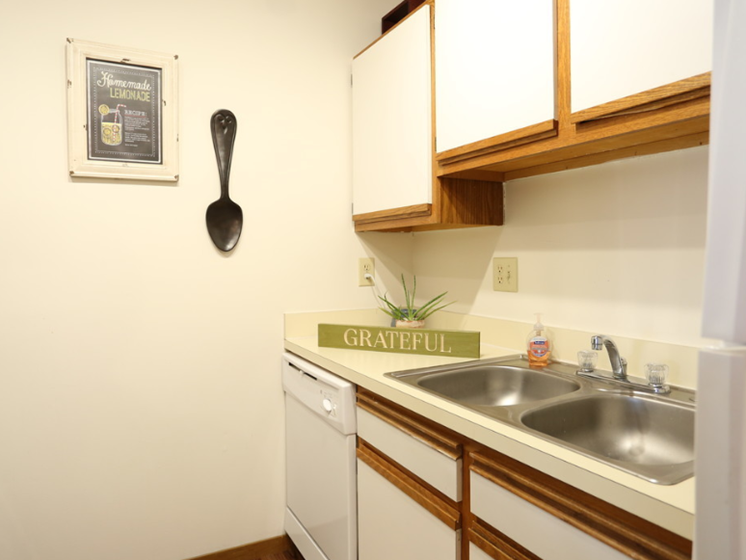 Image of kitchen with cabinets and sink